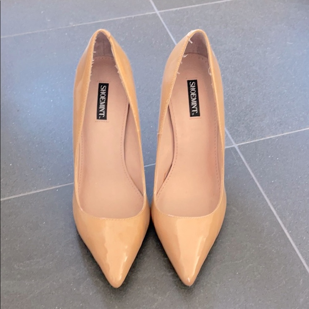 Tan patent leather heels.